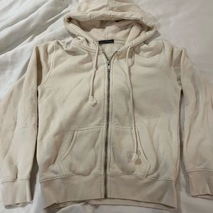 brandy melville. cream zip up. comfortable fit. OS